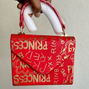 Small Red and Gold Handbag with Graffiti Design